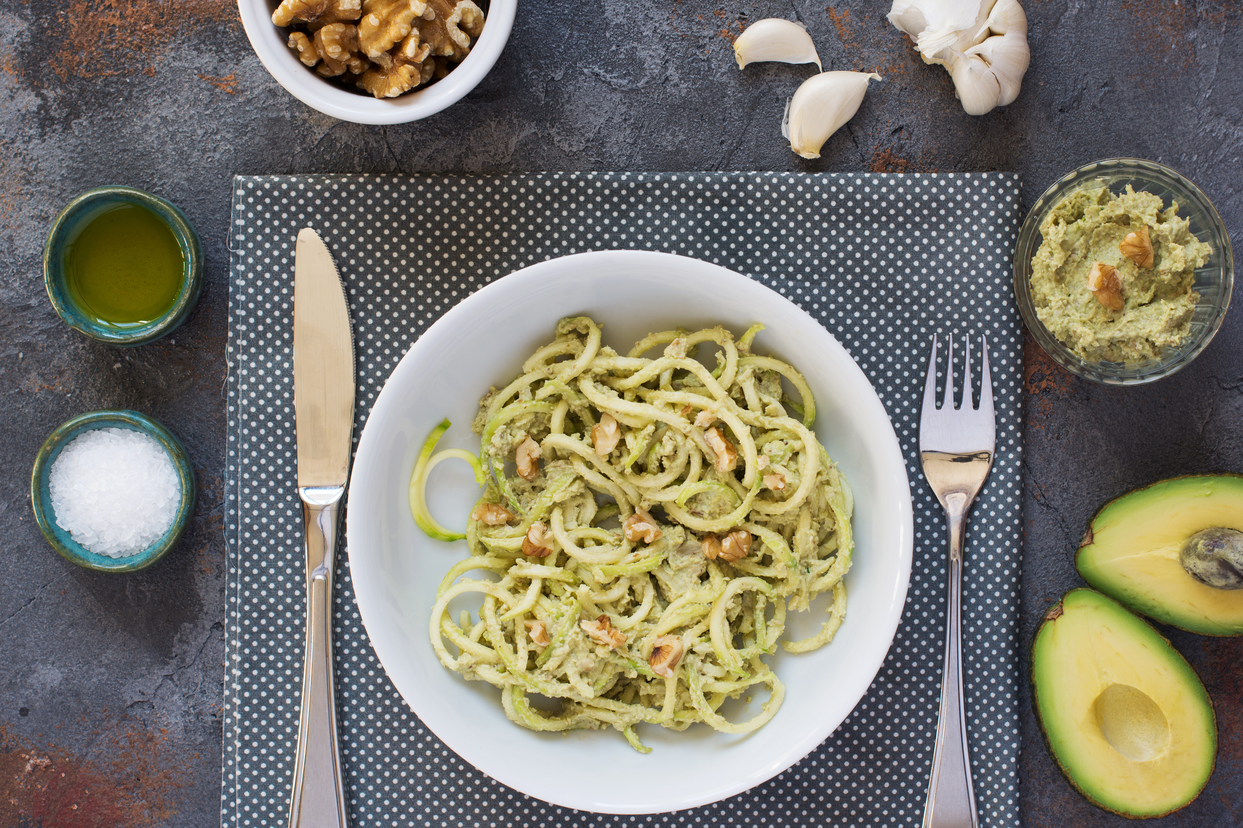 Think beyond guacamole. Pictured here are spiral zucchini noodles with avocado and walnut pesto.
