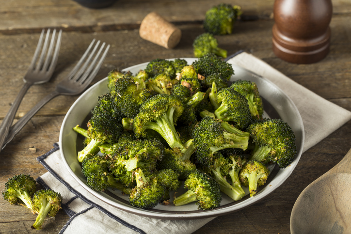 A bowl of delicious roasted broccoli. 