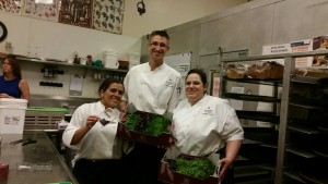 Chef Peter and the chefs of the Loews Portofino Bay Hotel garde manger team. Chef Peter likes to work with oddities and specialties with his team for beautiful plate ups. They are holding a box of sakura living greens and were happy to taste test the greens and use them the spot for plate ups!